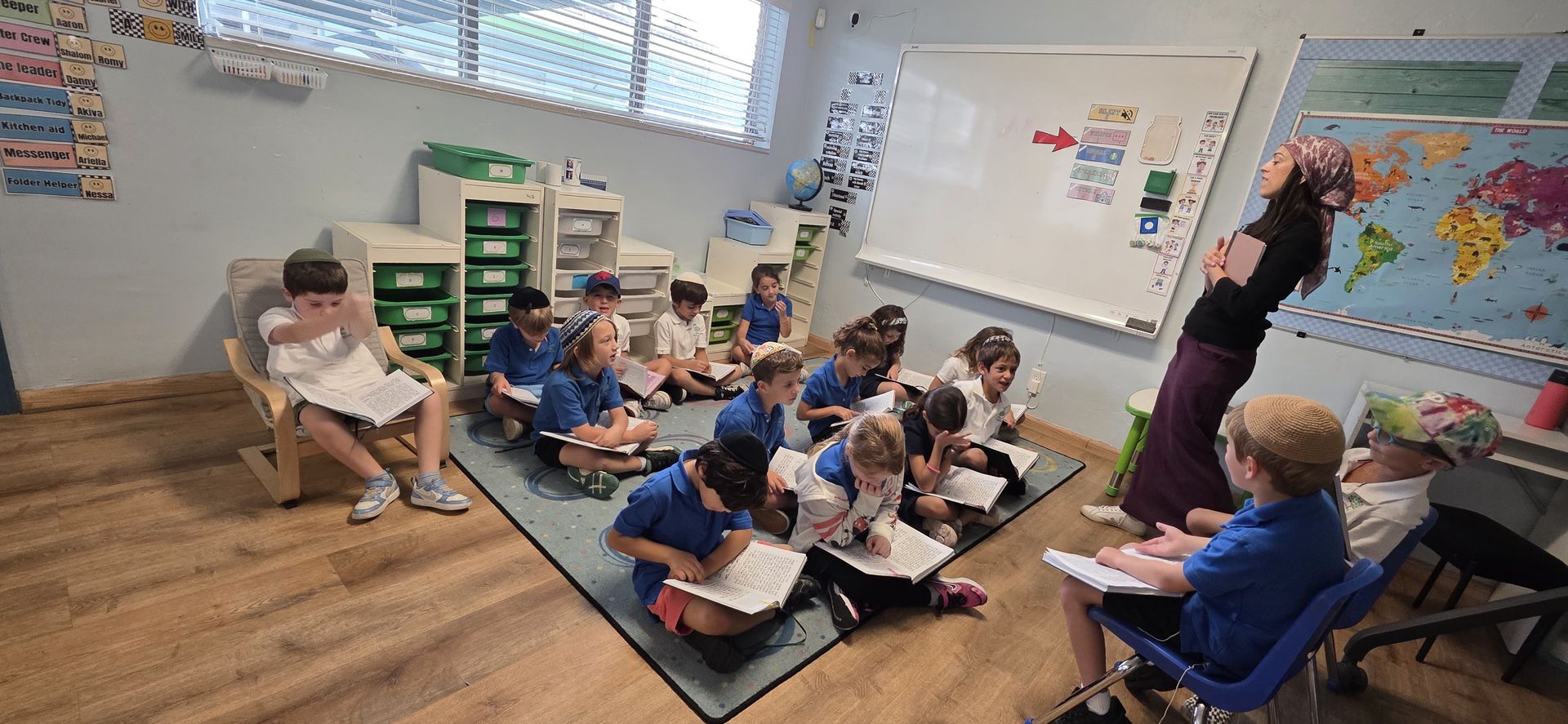 Students reading on the classroom rug