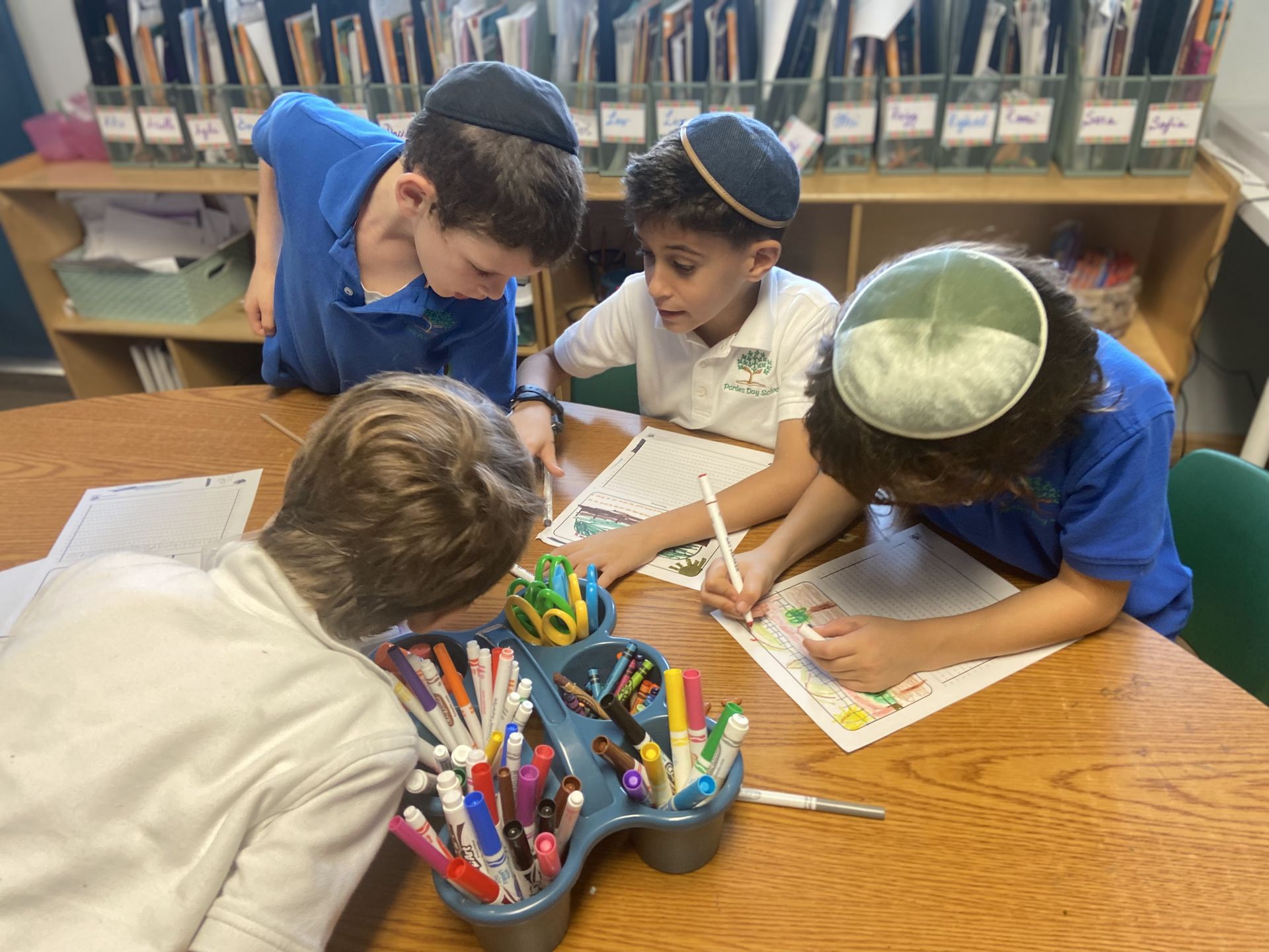 Students working together on a drawing