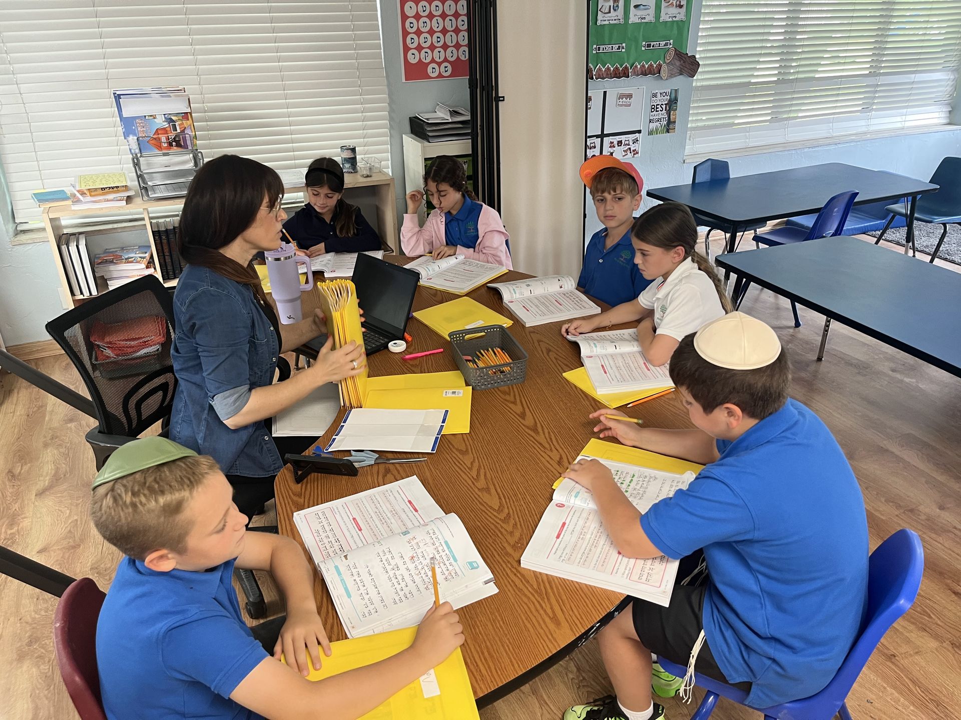 Students learning Chumash from their workbooks