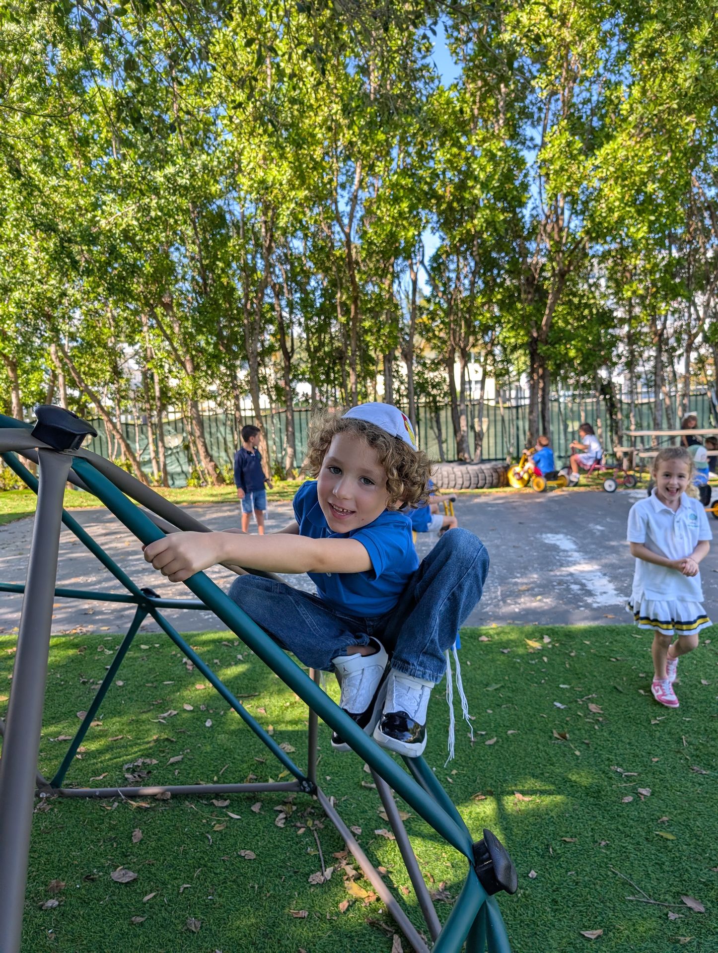 A student on the outdoor climbing frame