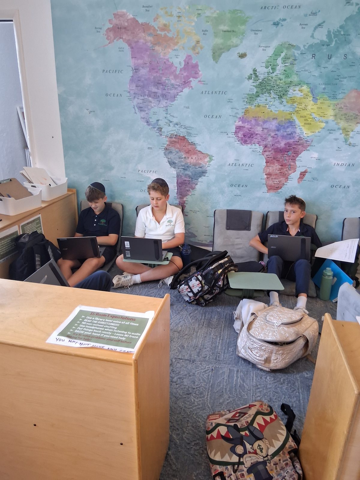 Students working on their laptops in the learning studio