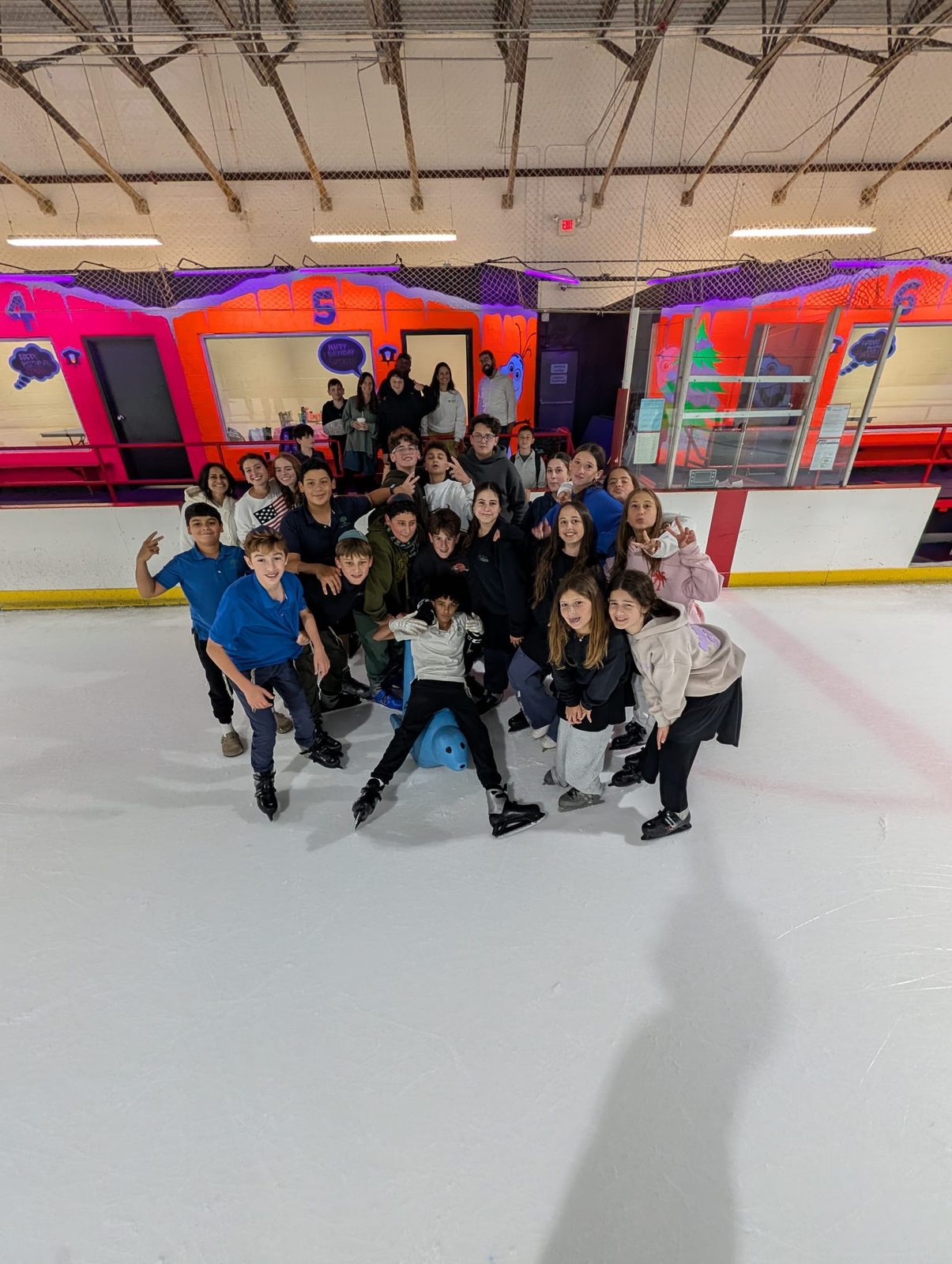 Middle school students together at a class ice-skating trip