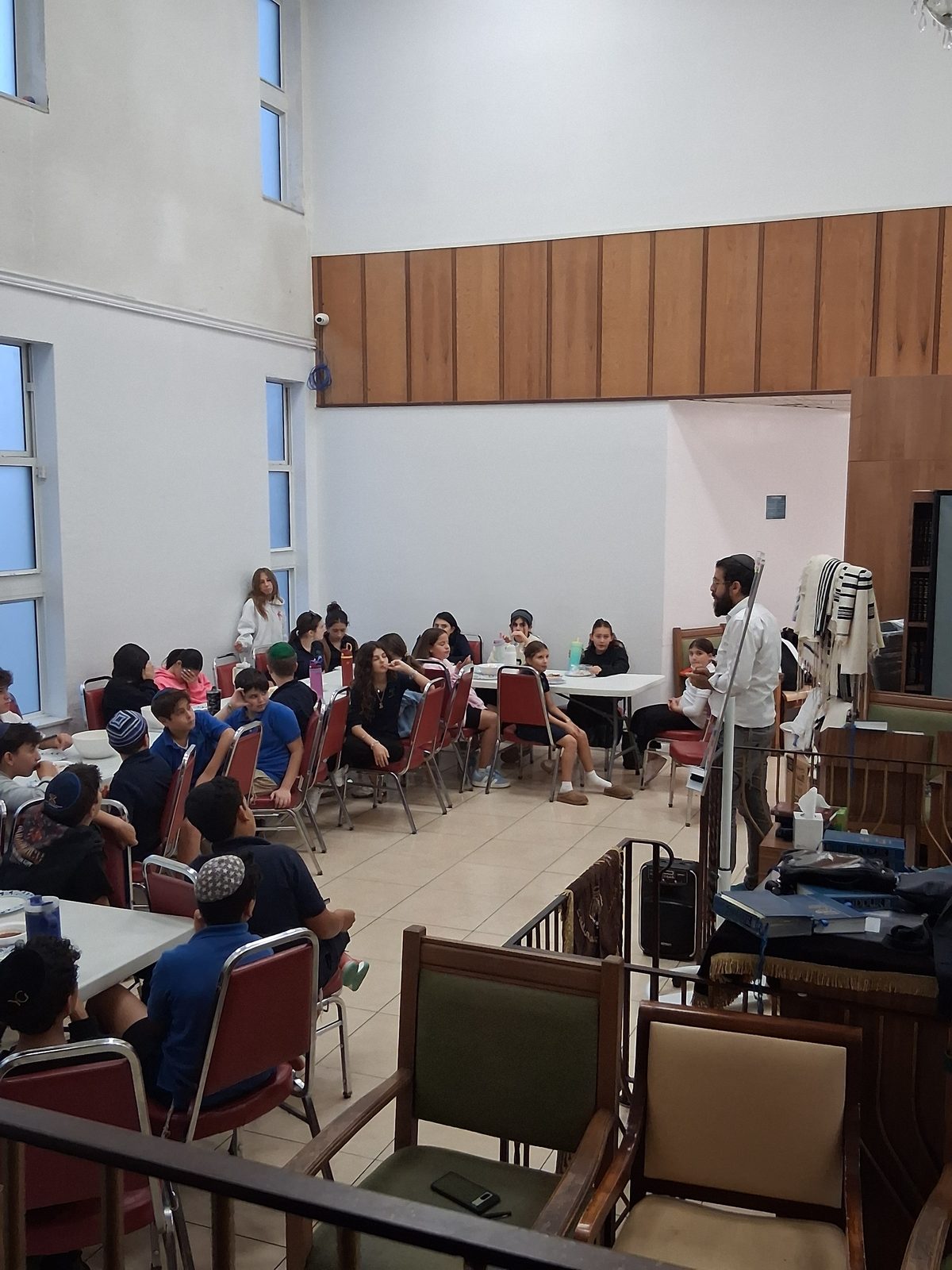 Students learning Torah together with their rebbe