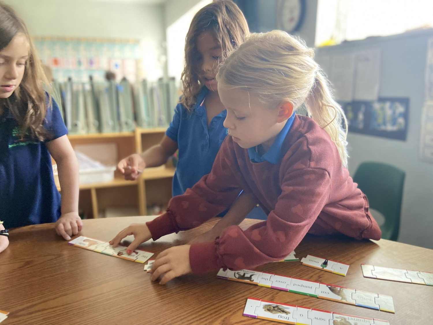 A student working with hands-on Hebrew materials